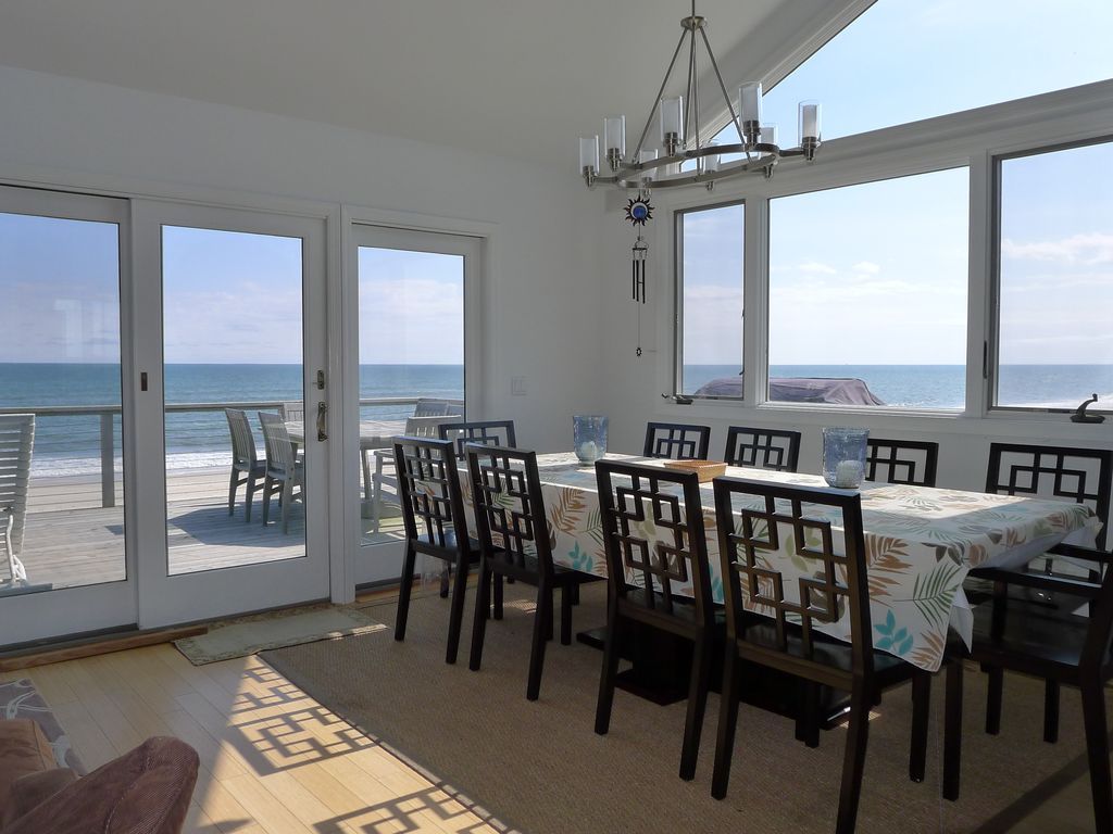 Large dining table with seating for 9 and ocean views!