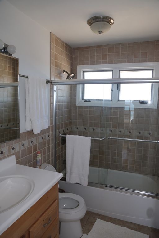 Master bathroom with glass shower/tub